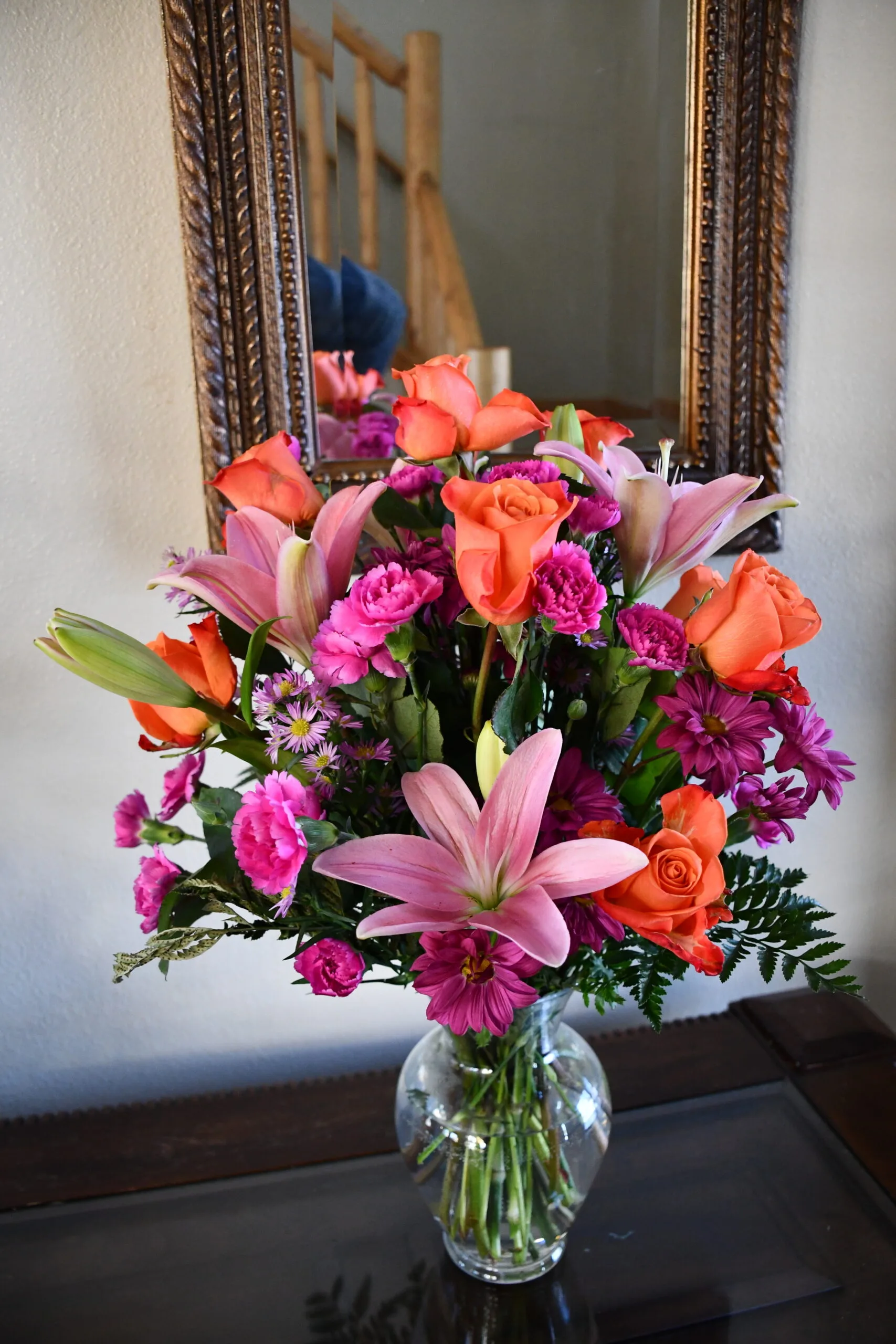 Colorful bouquet with roses and lilies in vase
