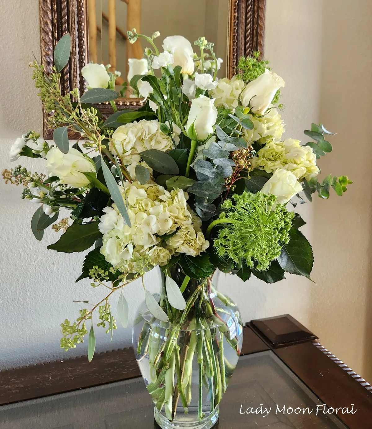 Elegant floral arrangement in clear glass vase